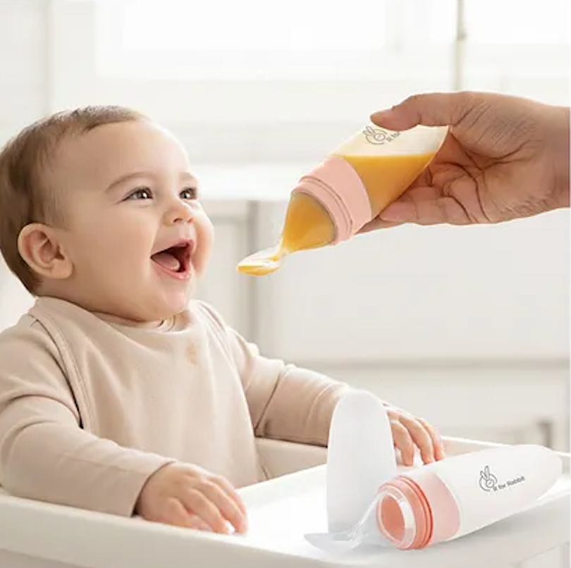 Silicone feeding set on a wooden high-chair tray