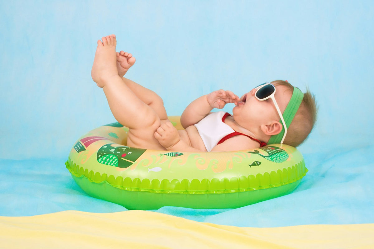 Newborn baby sleeping peacefully in a soft cradle